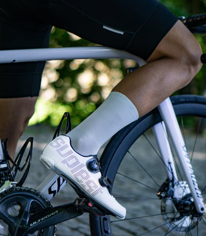 gray Luxa cycling socks on the cobbles