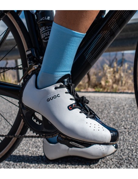Cyclists leg with light blue color cycling sock