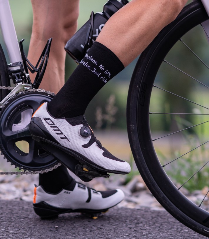 small inscription on right side of the sock with caption 'no plans no gps no rules'