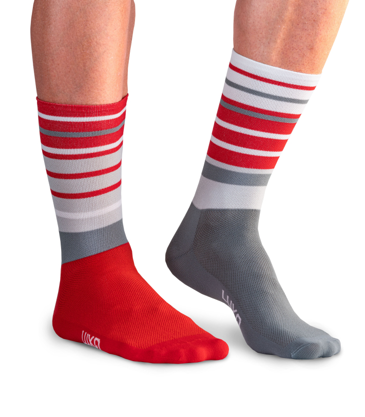 Close-up of red and white striped cycling socks worn on a ride.