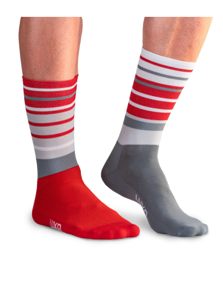 Close-up of red and white striped cycling socks worn on a ride.