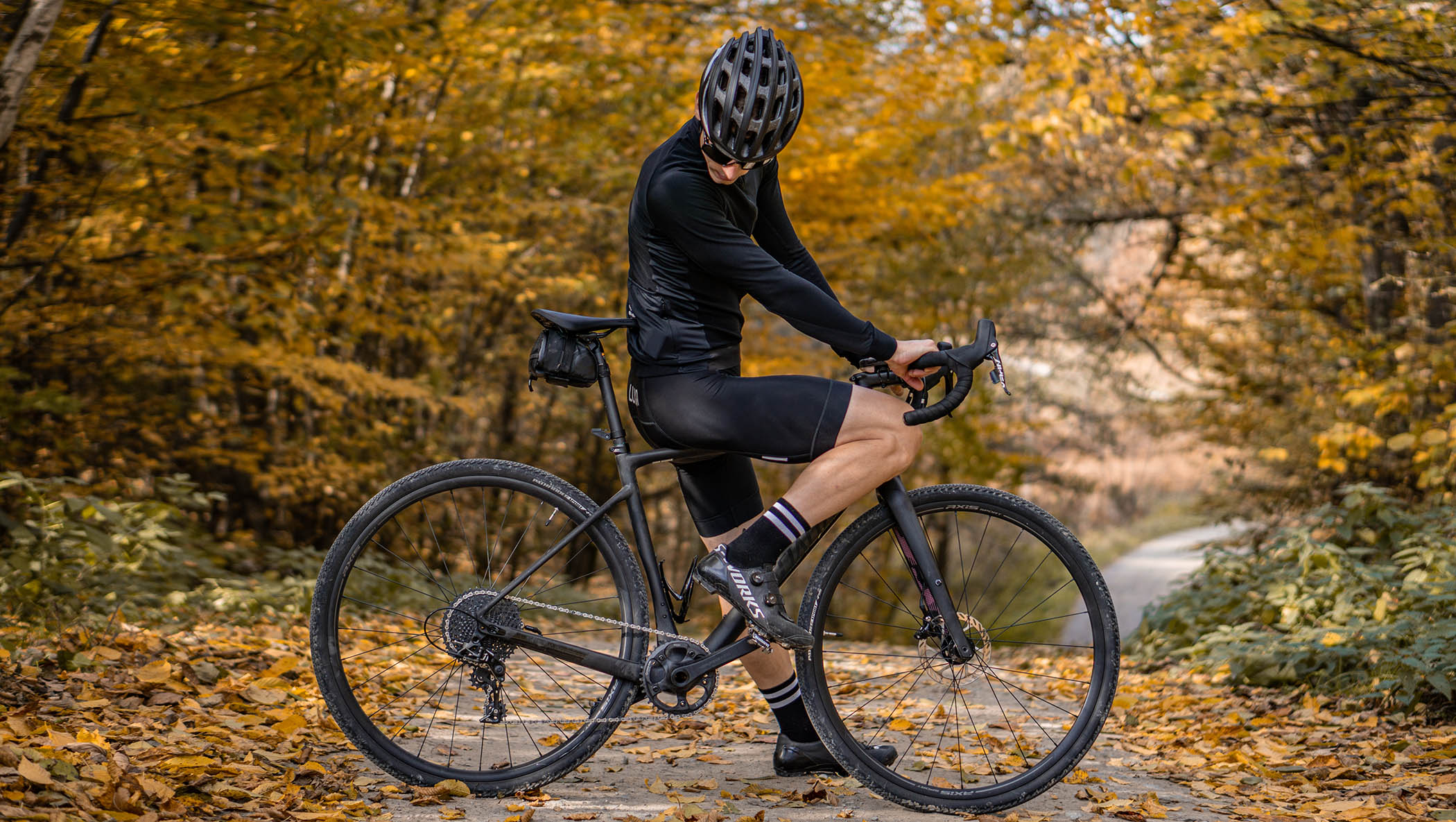 gravel bike and black luxa cycling kit