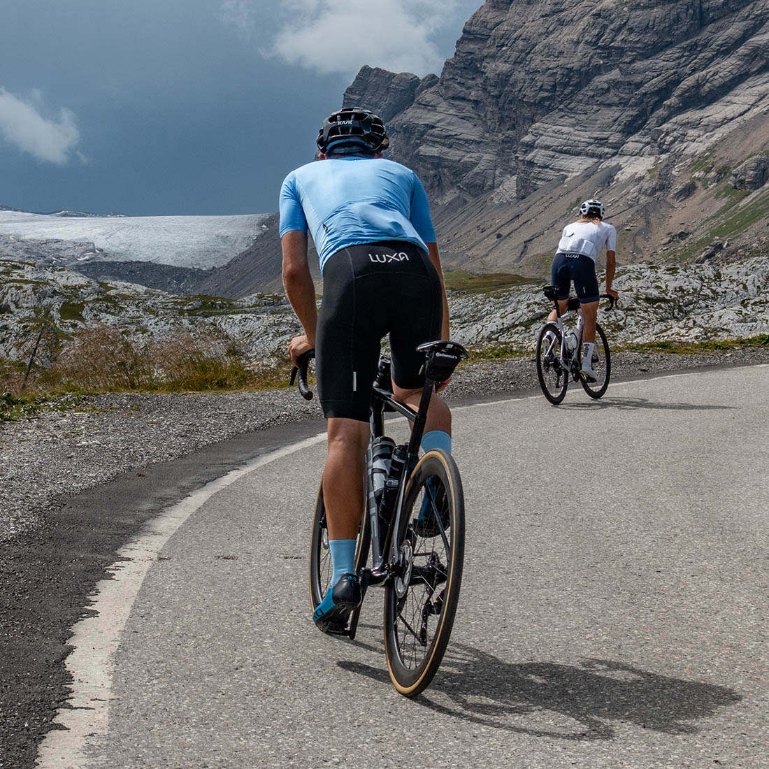 blue cycling kit tested on mountains and road male cyclist wear blue cycling socks